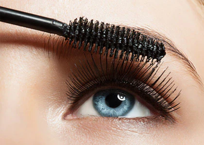 closeup of an eye with mascara being applied