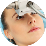 woman getting her eyes examined by some kind of device